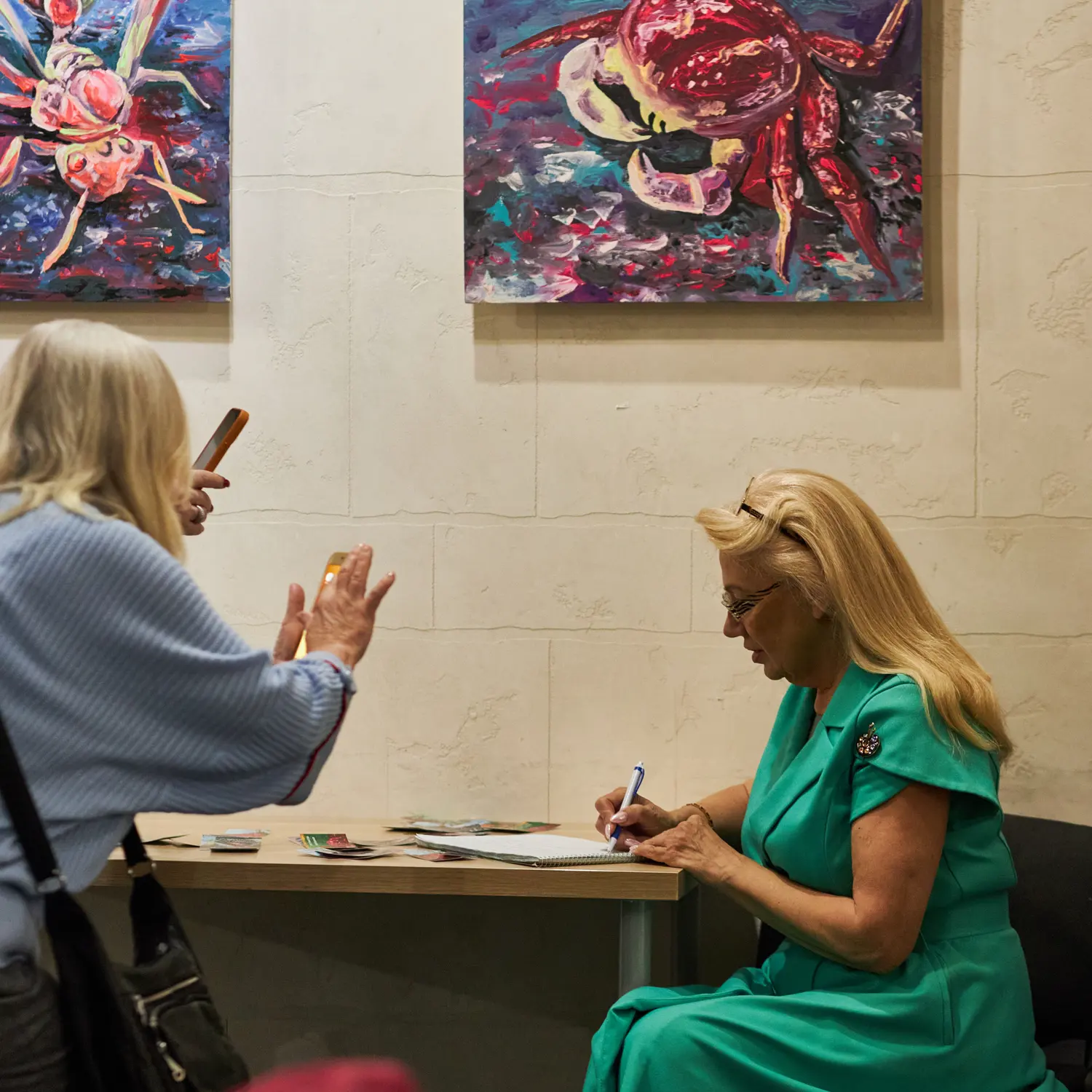 Exhibition view with paintings by Ilia Morozov